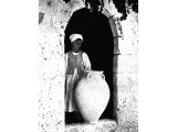 This pottery jar used for storage of olive oil was found during excavations on the site of Beth-shemesh at Ain Shems. An early photograph.